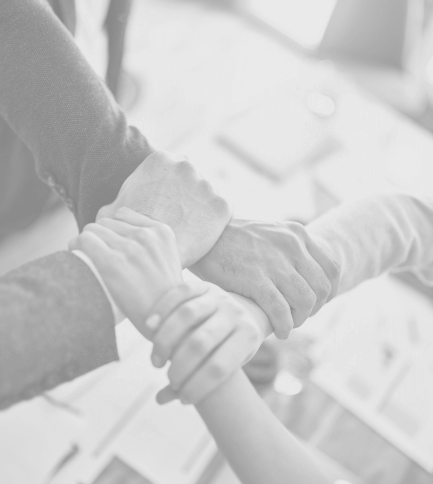 A group of people holding hands in a circle