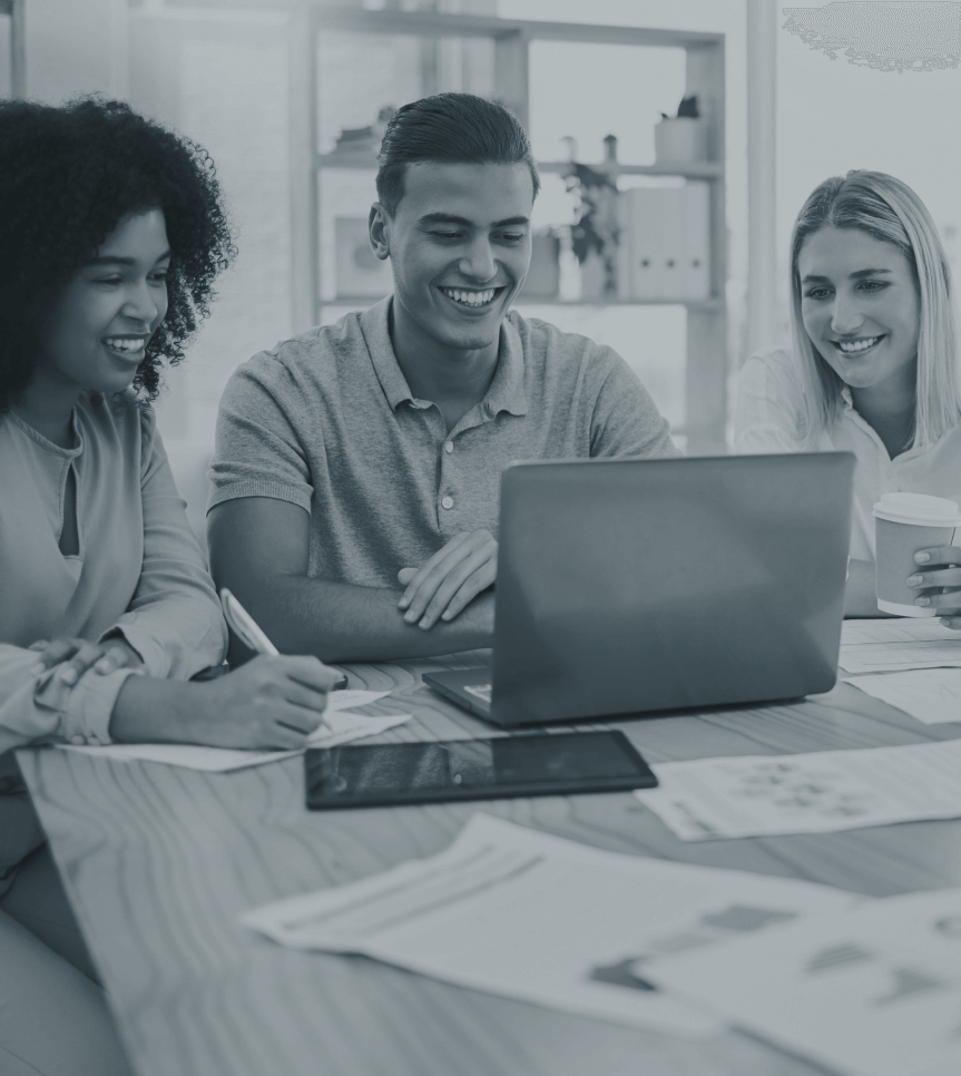 A group of people looking at a laptop